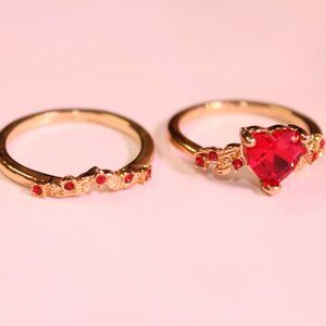 Golden Colored Ring set with Red Heart Gemstone Centerpiece